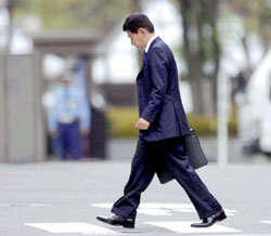 Former shareholder activist Yoshiaki Murakami walks to a Tokyo courthouse to hear the ruling on his case