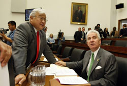 Rep. Michael Honda and Rep. Jim Costa talk as they wait for a markup session on the sex slave resolution to start in the House Foreign Affairs Committee on June 26 on Capitol Hill
