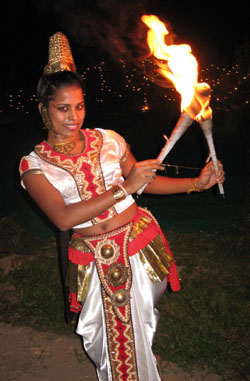Sri Lankan AUW student Ishara Piumi Warakagoda performs a traditional fire dance as a happy greeting to visitors to the campus