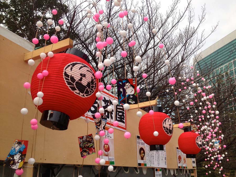 Festive decorations over food stalls Thanyamon Inthachai at Hamarikyu Park, Tokyo